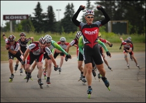 Randy Plett raises arms in victory