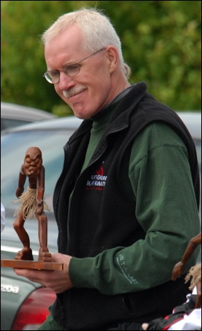 Online Inline organizer Terry Holm with trophy.